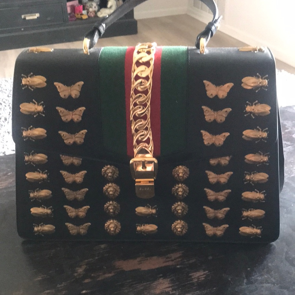 Elegant Black and Gold Shoulder Bag with Butterfly Motifs